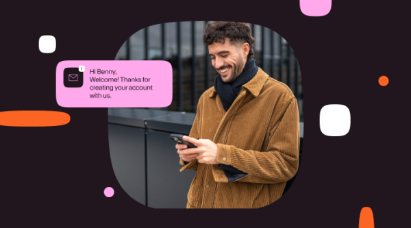 Illustration of a smiling man looking at his phone with a message notification bubble that reads: “Hi Benny, Welcome! Thanks for creating your account with us.” Decorative shapes appear around the image on a dark background.