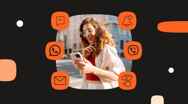 A woman standing on a city street smiles at her phone. Surrounding her are six orange rounded icons representing communication channels used in customer retention: chat message, mobile notification bell, WhatsApp, Viber, email, and a tap gesture icon. The background is black with abstract shapes, emphasizing omnichannel engagement and the importance of meeting customers on their preferred platforms.