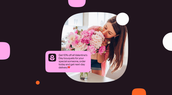 Woman arranging a bouquet of pink flowers with a promotional message that reads “Get 10% off Valentine’s Day bouquets for your special someone, order today and get next-day delivery,” showing a personalized Valentine’s Day marketing offer.