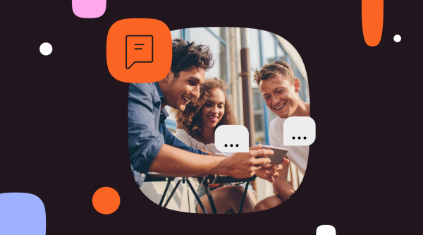 Group of friends smiling, viewing SMS messages on mobile devices.