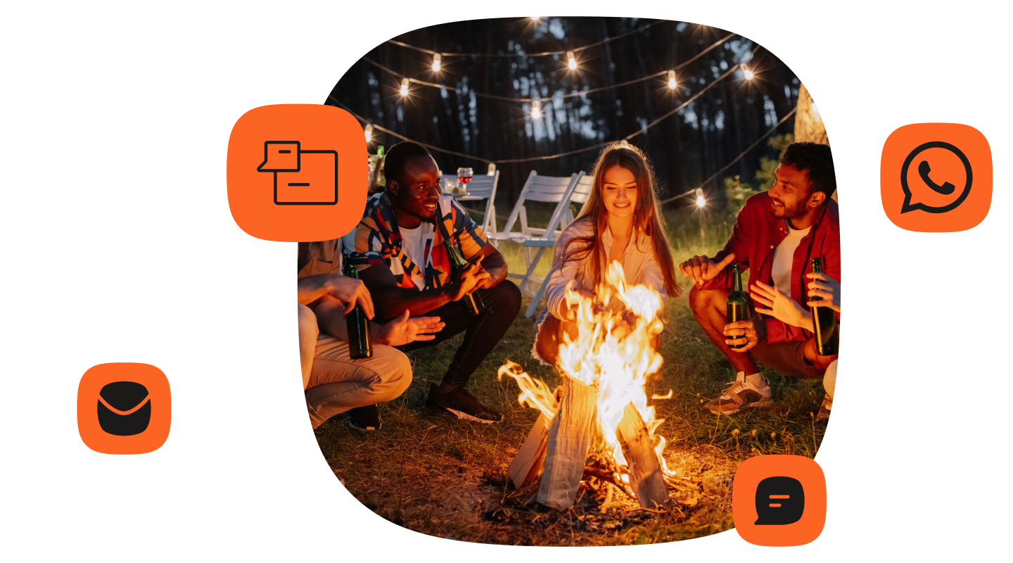 Group of friends gathered around a campfire at night under string lights, holding drinks and talking. Orange icons representing chat messages, WhatsApp, email, and SMS are arranged around the photo, symbolizing different messaging channels.