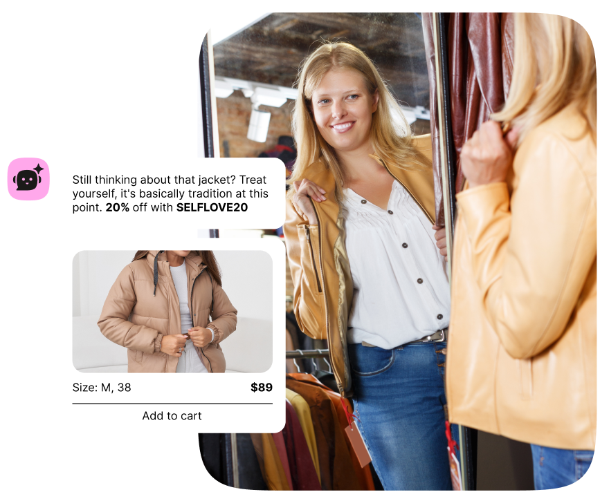 A woman smiles at her reflection while trying on a mustard-yellow jacket in a clothing store dressing room. Overlaid on the image is a chat message from an AI assistant icon that reads: 'Still thinking about that jacket? Treat yourself, it's basically tradition at this point. 20% off with SELFLOVE20.' Below the message is a product card showing the same tan puffer jacket, listed as Size M/38, priced at $89, with an 'Add to cart' button.
