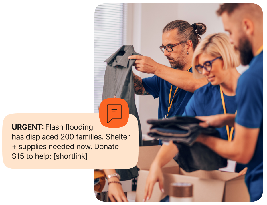 An image showcasing people putting clothing and supplies in boxes with an overlay message that reads: URGENT flash flooding has displaced 200 families. Shelter + supplies needed now. Donate $15 to help.