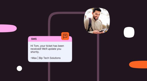 A visual showing a text message signature in an SMS conversation, with the message , "Hi Tom, your ticket has been received! We’ll update you shortly." signed as "–Max | Bip Tech Solutions," accompanied by an image of a man holding a smartphone outdoors.