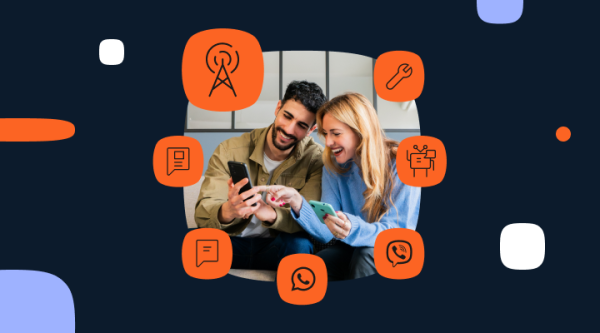 A man and a woman sit together, each holding a smartphone, interacting with their devices. Surrounding them are orange icons representing communication and technology concepts, including a communication tower, wrench, chatbot, speech bubble, message, WhatsApp logo, and phone call.