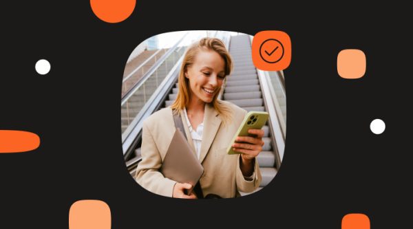 Header image of a smiling woman checking her phone while standing on an escalator, used to illustrate RCS read receipts in action.