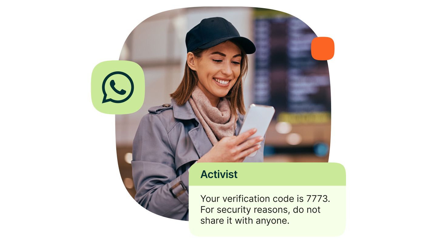 Woman looking at a smartphone. A WhatsApp message from “Activist” reads: “Your verification code is 7773. For security reasons, do not share it with anyone.”