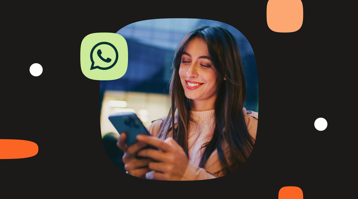 Woman using a smartphone at night with a WhatsApp icon overlay on a dark background.