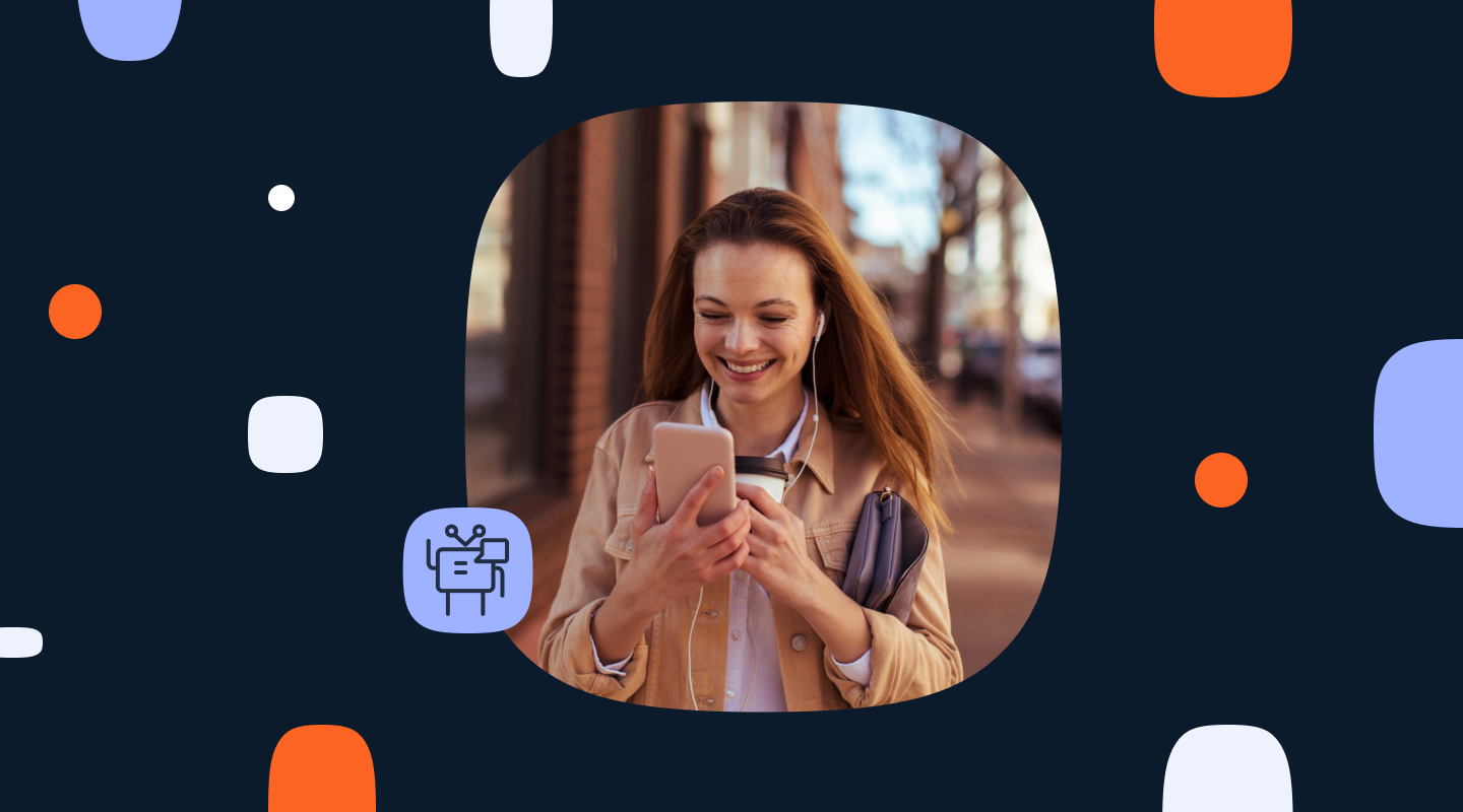 A woman smiling and looking at her phone while walking on a city street, with a small AI agent icon overlaid in the lower left corner.