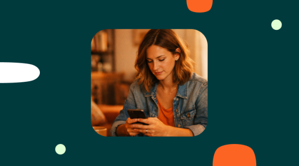 Photo on a dark teal background showing a person seated indoors and holding a smartphone with both hands. The person is wearing a denim jacket over an orange top, and their face is blurred. Rounded decorative shapes in orange, white, and light green surround the image.