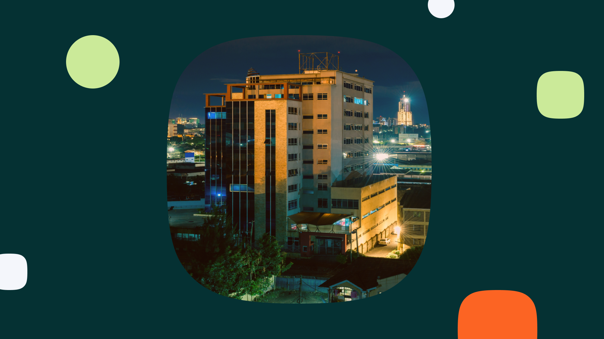 Nighttime cityscape featuring a modern office building, representing the setting for Leadership Soirée East Africa Edition.